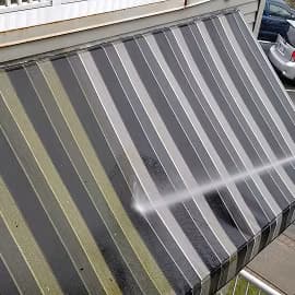 Commercial pressure washing service in progress